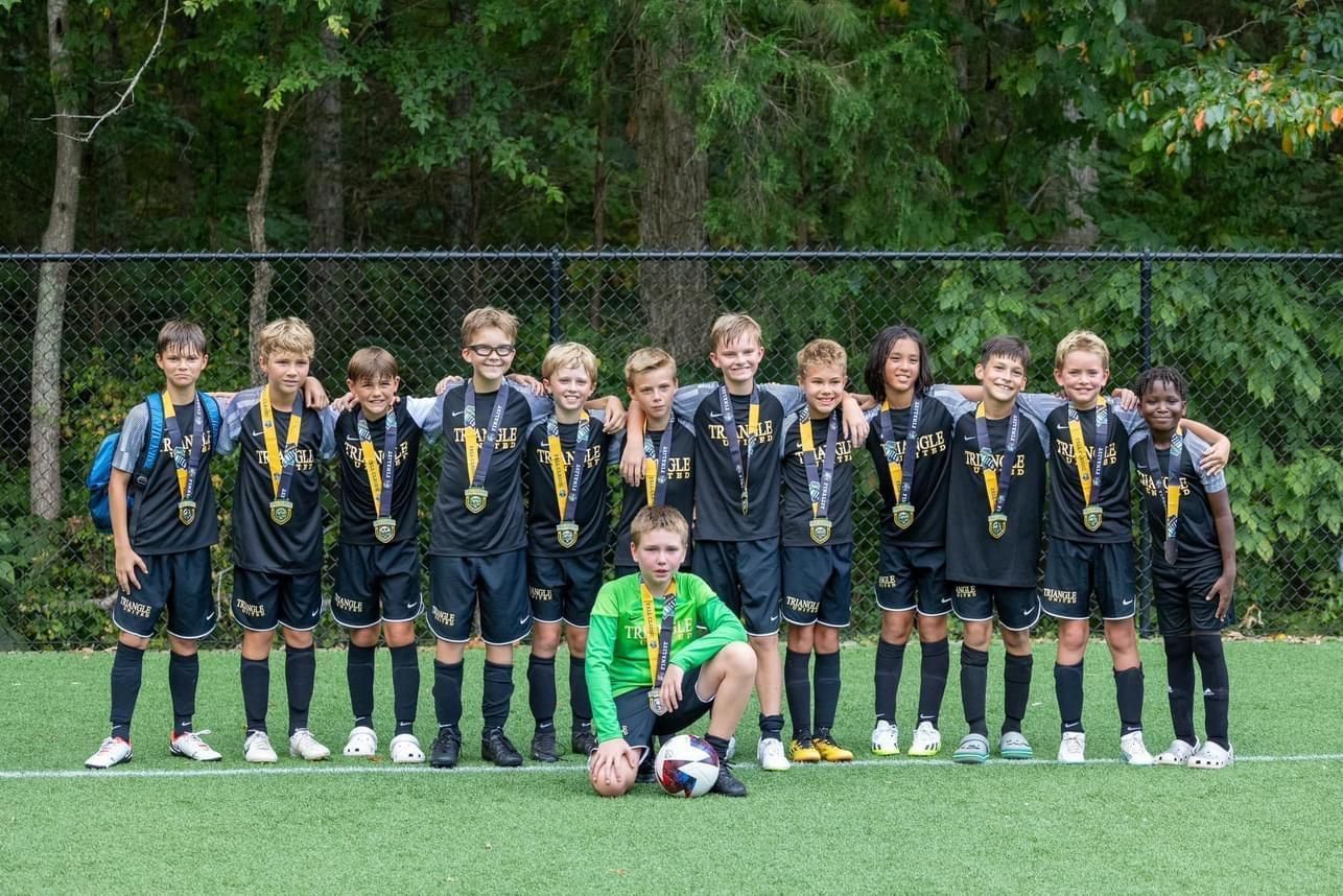 Triangle United Classic team posing as tournament finalists