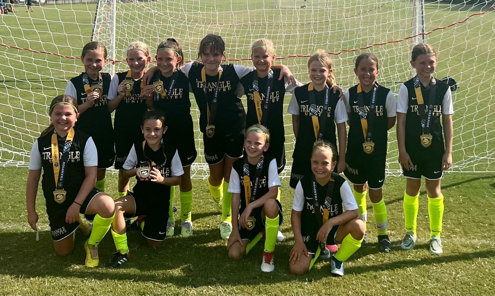 Girls Academy players celebrating a championship win