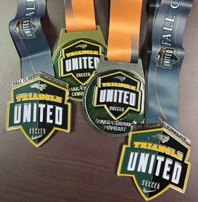Triangle United tournament medals from the Fall Classic